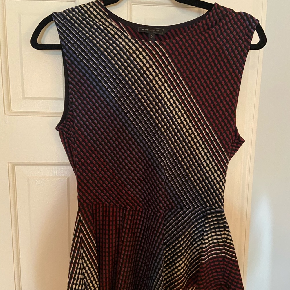 BCBGMAXAZRIA peplum, asymmetrical bottom,  blouse